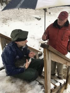 John Cooley holding rescued Loon